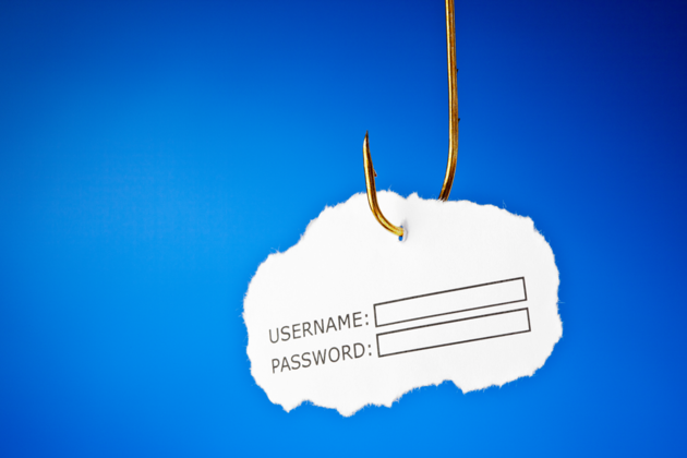Ein Papierschnippsel mit einem Log-In an einem Haken.